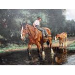 Wright Barker RBA (1864-1941) A young man sitting sideways on a working horse crossing a ford with a