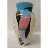 Sally Tuffin Dennis China Works, a baluster Vase, tubeline decorated with a Family of Penguins on