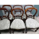 A set of six Victorian mahogany balloon back Dining Chairs, carved scroll back rail, stuff over