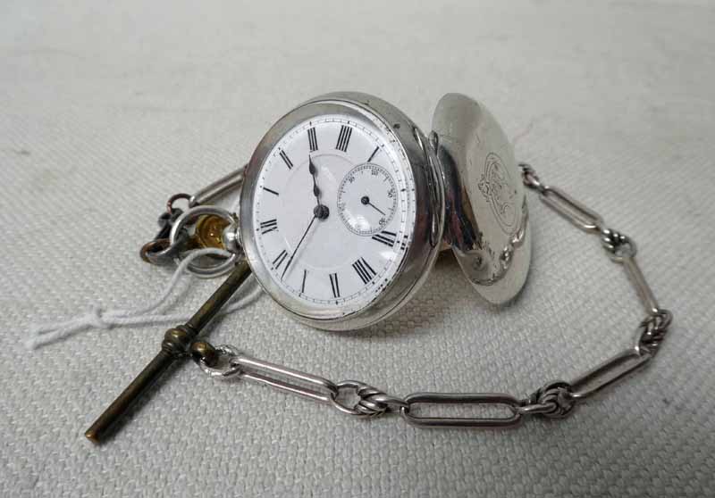 A ladies silver open face Fob Watch with plain white enamel dial, subsidiary seconds sweep dial on