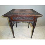 An early 20th century possibly Burmese hardwood occasional Table, square moulded edge top