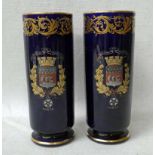 A pair of French early 20th century Armorial Vases, cylindrical on raised foot, Paris Crest