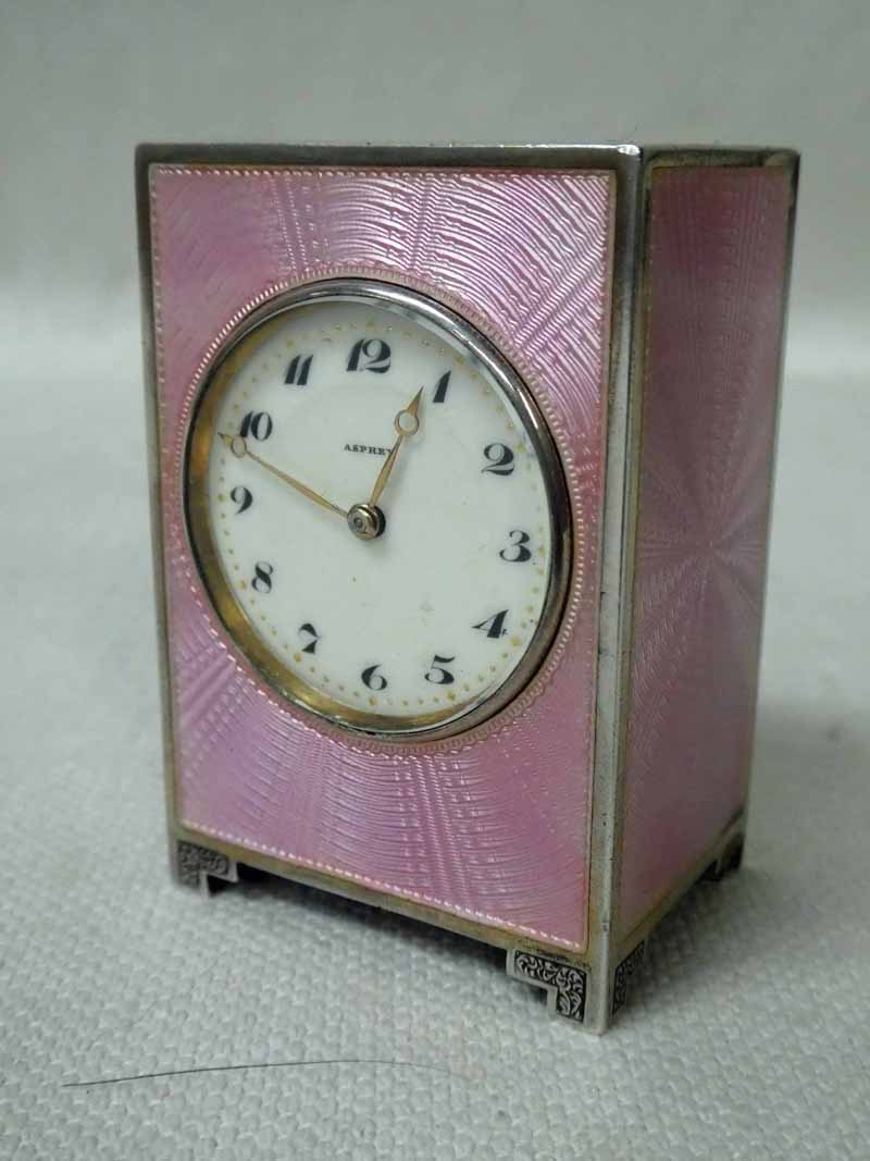 A small early 20th century Art Deco silver Cabinet or Desk Clock by Asprey, rectangular form on