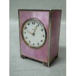 A small early 20th century Art Deco silver Cabinet or Desk Clock by Asprey, rectangular form on