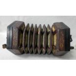 A Concertina by C. Jefferies, hexagonal with silver plated pierced ends and fifty-one buttons,