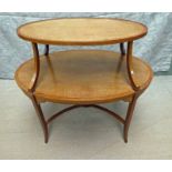 An Edwardian Regency style Satinwood two-tier Tea Table, oval form with crossbanded edges, boxwood