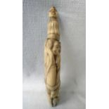 A short carved ivory Tusk, relief carved depicting native African figures in two bands surmounted by
