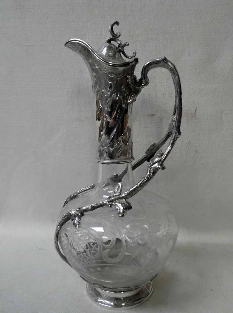 A fine Victorian etched glass Claret Jug, typical form with silver plated mount to neck with