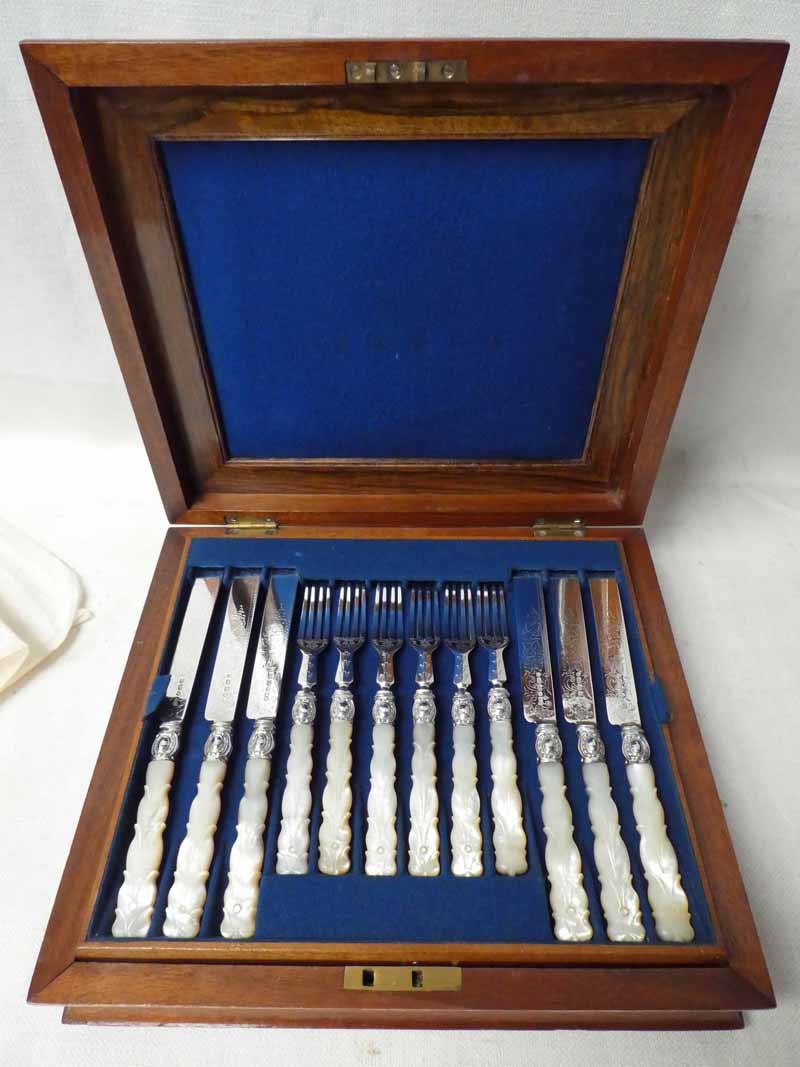 A good quality Victorian Canteen of Dessert Cutlery, silver forks and knives with mother of pearl