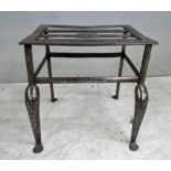 A George III steel and wrought iron Footman with five bar top and stretchers to all sides, wrought