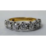 An 18ct gold and diamond Half Eternity Ring, seven brilliant cut stones in four claw white gold