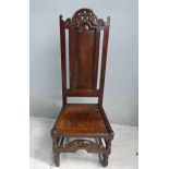 A late 17th/early 18th century oak Side Chair, pierced crest rail with scrolls and hazelnuts, arch