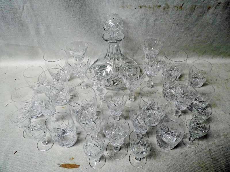 Stuart Glengarry: a suite of cut glass crystal ship's style decanter and thirty glasses, including