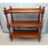 A Victorian mahogany three-tier buffet, rectangular form with low gallery to top tier, two shelves