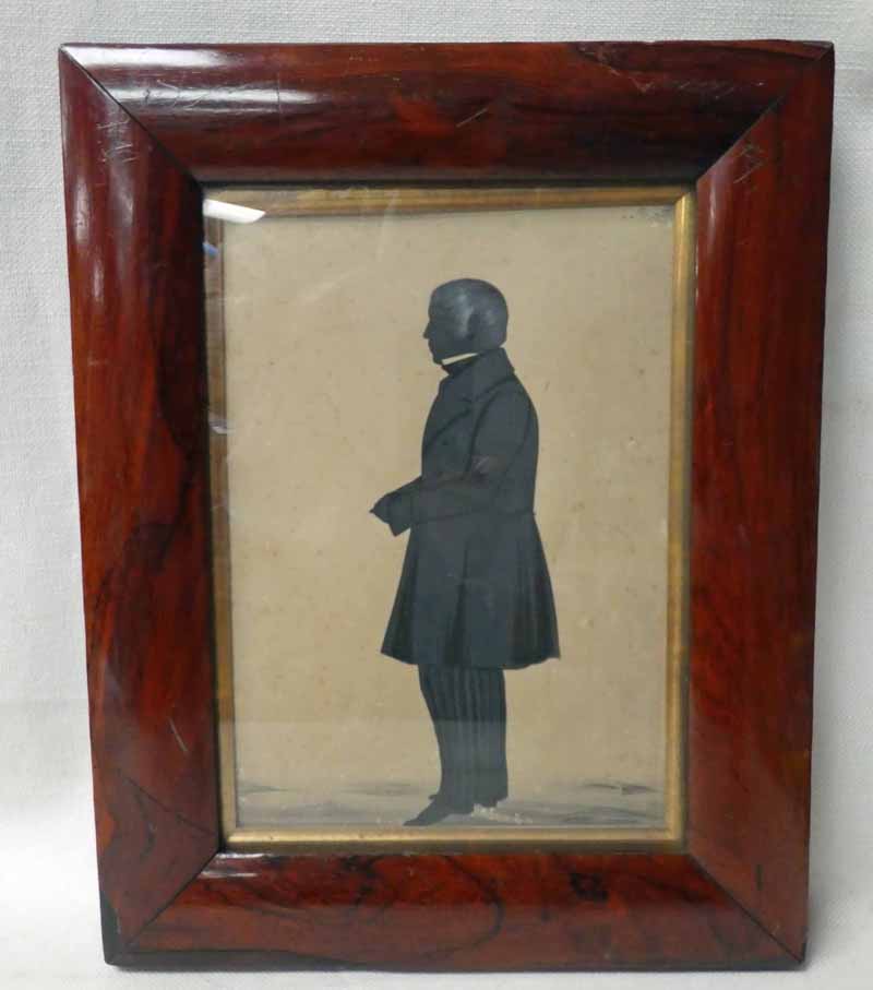 An early 19th century mahogany framed Silhouette of an eminent gentleman in profile dressed in frock