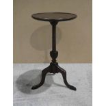 A Georgian style mahogany Wine Table, dished circular top on turned and carved support and triform