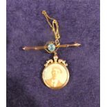 A yellow metal Bar Brooch, marked 9c, with a blue stone and a pendulous 9ct gold Double Locket, 4.7g