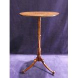 A Victorian mahogany Wine Table, flat circular top, tapering ring turned stem, triform support, ring