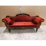 A late Victorian mahogany show frame double ended Chaise Lounge, reupholstered in terracotta