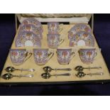 A Royal Worcester Bone China Coffee Service in a fitted black & gilt tooled case with ivory silk