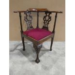 A 20th century Georgian style mahogany Corner Chair, raised bow shape top rail, openwork splats