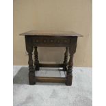A 19th century oak Joined Stool, Jacobean style, moulded rectangular top, block turned legs with