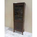 An early 20th century mahogany Bookcase, astral glazed door to upper portion enclosing shelves,
