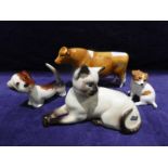 A Beswick Guernsey Bull CH Sabrina's Sir Richmond 14th a Beswick Siamese Cat 1558, 19cm long, a