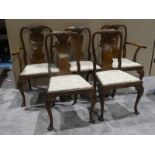 A set of five walnut Queen Anne style Dining Chairs including a pair of Carvers, shell and ribbon
