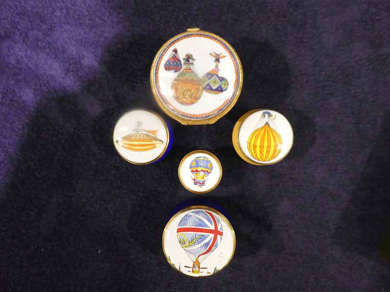 Five enamel and gilt and metal pill boxes, all with ballooning theme, one by Royal Worcester and