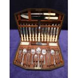 A good quality mid 20th century oak cased sixty-seven piece Canteen of Cutlery by John Barker of