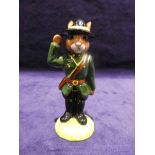A rare Royal Doulton Bunnykins Sergeant Mountie in green, yellow and black colourway, stamped Not