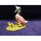 A Beswick Beatrix Potter model: Jemima and her Ducklings, boxed, 11cm tall