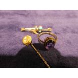 A 10ct gold Stick Pin, a 9ct gold Turquoise and Split Pearl set Bar Brooch and a Yellow metal ring