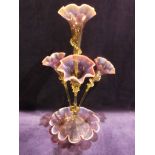 A Victorian coloured glass four-branch Epergne, typical crimped form with central vase surrounded by