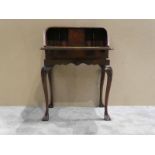 An early 20th century Georgian style flame mahogany Ladies Bureau, crossbanded rectangular top,