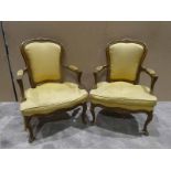 A pair of Italian style show frame Arm Chairs, upholstered backs, elbow supports and cushions in