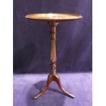 A Georgian style mahogany Wine Table, dished circular top octagonal and ring turned stem on tripod