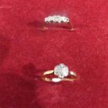 A Ladies Diamond Ring marked 18c set with seven small diamonds, size O and a Ladies Ring marked 18ct