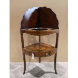 A late Georgian mahogany corner Wash Stand, typical form with lancet shape back behind three well