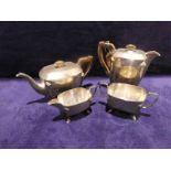 A mid 20th century Art Deco style silver four-piece Tea Service, rounded rectangular form, hinged