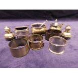 Twelve items of small silver tableware, five odd napkin rings pair of small salt and pepperette, two