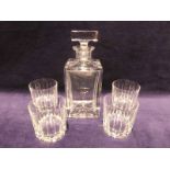A late 20th century heavy crystal glass Decanter, square form with star cut base and square stopper,
