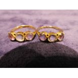 A pair of Victorian 18ct gold three-stone Dress Rings, 3.6g gross