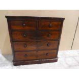 A Victorian mahogany Chest of two over three drawers on a plinth base, corners to front, top heavily