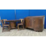 Art Deco Dining Suite by Ernest Gomme, constructed of oak with rosewood banding, it comprises a draw