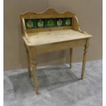 A Victorian stripped pine Washstand with floral tiled backsplash on turned legs, 89cm by 48cm by