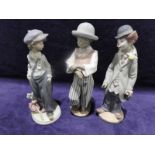 Three Lladro porcelain figures: Boy Tramp 5400, 21cm high, Black Boy Traveller 5932, 22cm high and