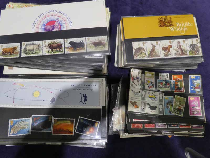 A box of first day covers and loose GB stamps