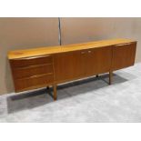 A H McIntosh & Co Ltd, a 1970's teak 'long John' Sideboard, rectangular top above a pair of